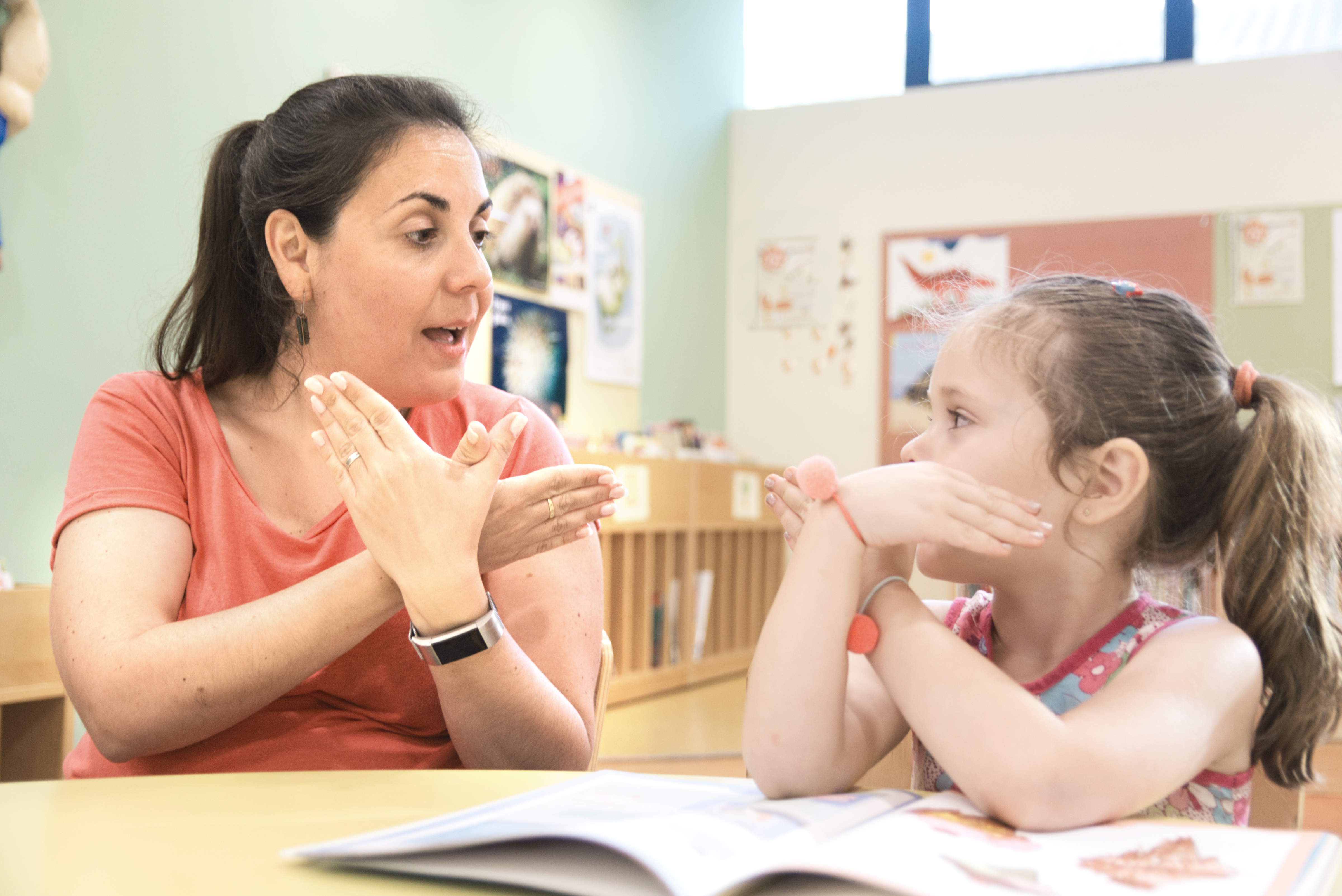 Speech Language Pathologist Assistant supporting a student